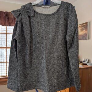 Silver-gray sweater with bow shoulder detail